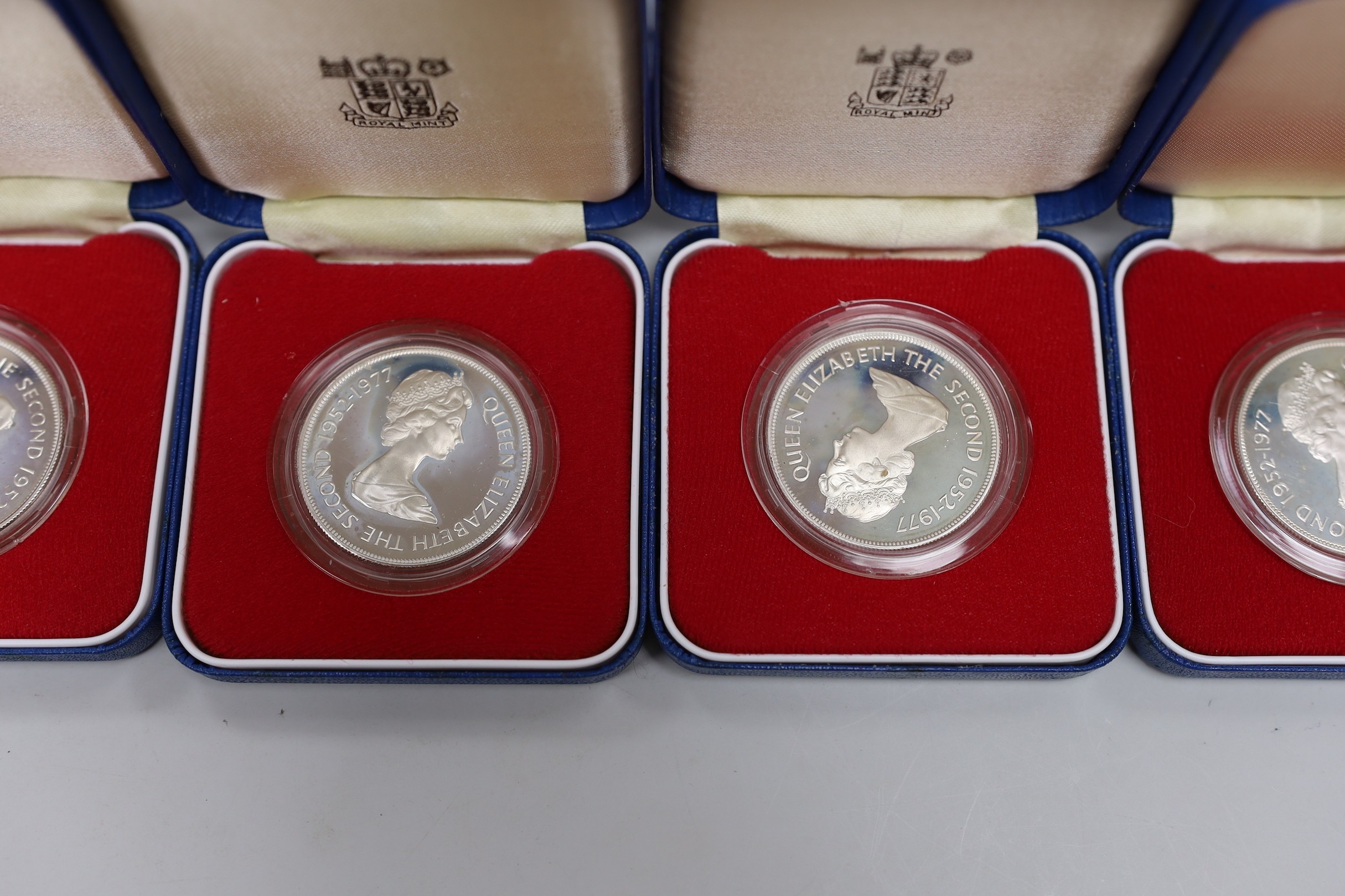 Eleven Royal Mint Commonwealth commemorative proof silver crowns